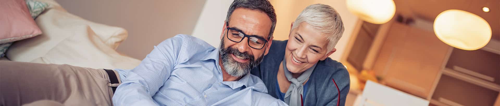 middle aged couple reading